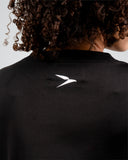 Conquer T-Shirt in Power Black neckline and subtle branding detail – premium athletic t-shirt by I AM-ABLE